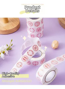 Close-up of circular 'Made with Love' adhesive labels for gift wrapping and packaging
