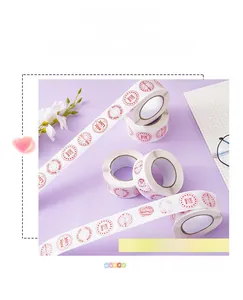 Close-up of heart label stickers on rolls featuring the red Made With Love design print