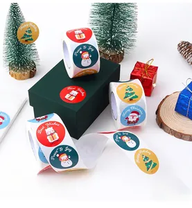 Detail of Christmas roll stickers featuring snowmen and Santa for gift wrapping