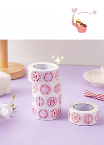 Macro shot of circular 'MADE WITH LOVE' stickers roll for gift wrapping and decoration