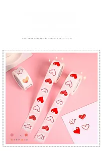 Detail of assorted red heart stickers on rolls for Valentine's gift wrapping and DIY decor