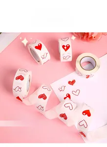 Macro shot of assorted red heart adhesive stickers on a roll for gift decoration