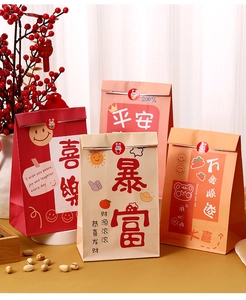 Detail of colorful gift paper bags with cute rabbit stickers and festive greetings