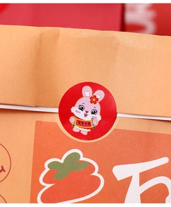 Macro shot of a red Rabbit Year sticker on brown kraft paper gift bag for New Year