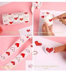 Detail of 500 red heart stickers roll showing decorative patterns and skin application