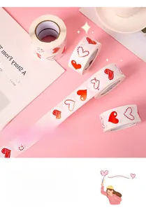 Close-up of decorative red heart-shaped sticker roll for romantic gift wrapping decor