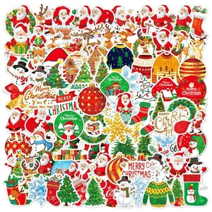 Detailed view of assorted holographic Christmas stickers featuring Santa, reindeer and snowmen
