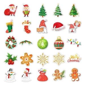 Flat lay of 25 holographic Christmas stickers featuring Santa, trees, and reindeer icons