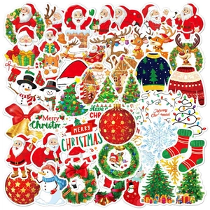 Macro shot of colorful holographic Christmas stickers with Santa and reindeer motifs
