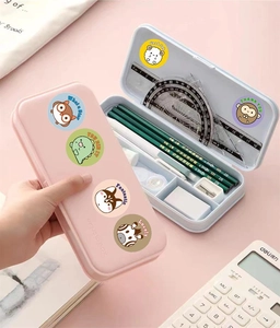 Detail view of pink pencil box set with cute animal stickers and school stationery
