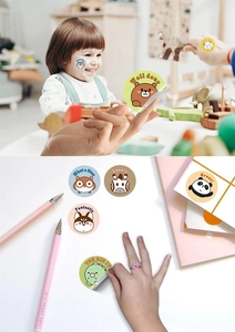 Close-up of cute cartoon animal reward stickers used on notebooks and stationery