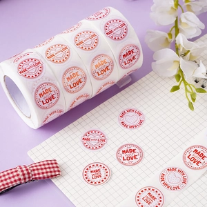 Roll of round Made with Love heart stickers for gift packaging and commercial decor