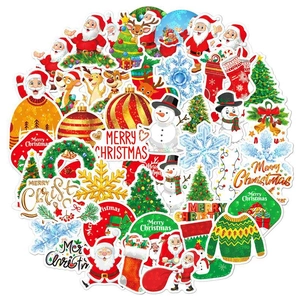 Detail of colorful holographic Christmas stickers with Santa and reindeer designs