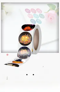 Detail view of round Halloween stickers roll featuring pumpkin and wizard hat patterns
