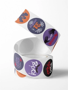 Macro shot of colorful Halloween roll stickers with ghost and spider web designs