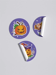 Macro detail of Halloween roll stickers featuring pumpkin designs and adhesive texture
