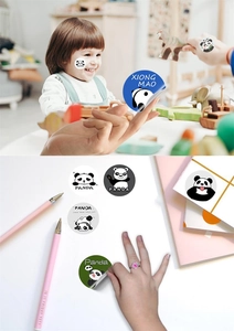 Close-up of cute cartoon panda reward stickers for kids stationery and creative scrapbooking