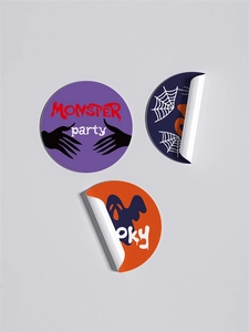 Macro detail of Halloween monster party stickers with spiders and ghosts on rolls