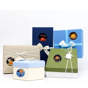 Halloween pumpkin and ghost decorative stickers applied on colorful gift boxes