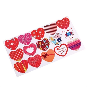 Detailed close-up of 16 assorted heart-shaped Valentine's Day stickers with gold foil accents