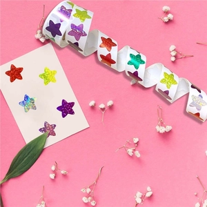 Roll of holographic glitter star stickers in various colors for rewards and decoration