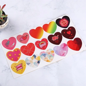 Detail of 16 heart-shaped Valentine's Day stickers with gold stamping on marble background