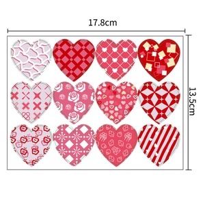 Valentine heart sticker sheet with 12 patterns in red and pink including stripes and dots