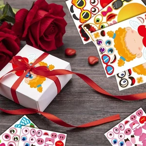 Close-up of DIY Cupid angel stickers decorating a gift box on a wooden desk