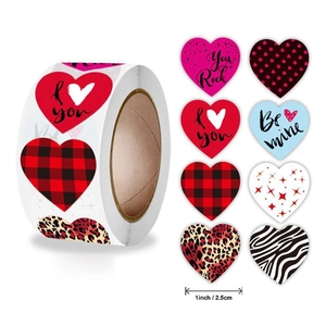 Detail view of 1-inch heart-shaped Valentine stickers in a roll with 8 festive patterns