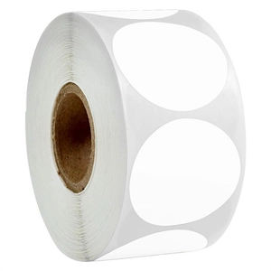 Macro detail of a white circular adhesive sticker roll with a brown paper core