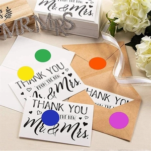 Macro detail of colorful round labels used as envelope seals for wedding stationery