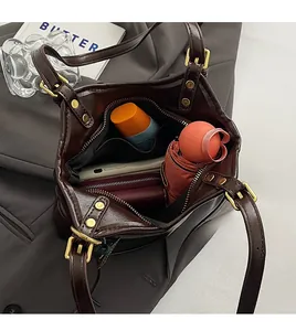 Internal view of dark brown vintage oil wax leather bag with large storage capacity