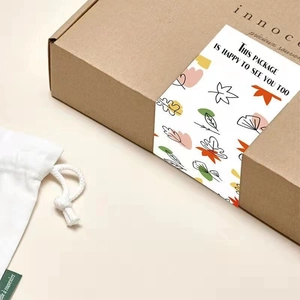 Corrugated gift box with floral seal label and cotton drawstring bag packaging