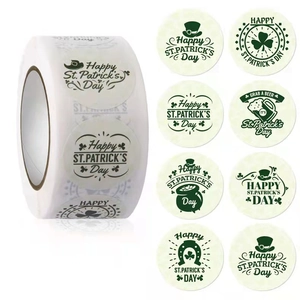 St. Patrick's Day round green stickers roll featuring clover and horseshoe designs