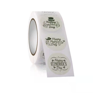Macro view of St. Patrick's Day round roll stickers with green shamrock patterns
