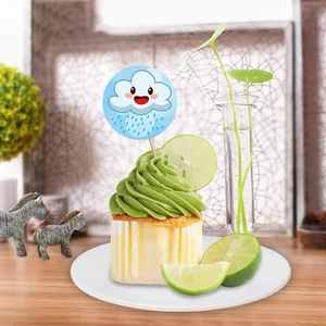 Cloud and raindrop cupcake toppers for kids parties on a green swirl frosting cake