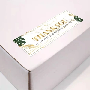 Detail of marble texture rectangular thank you sticker with gold foil on white box