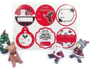 Detail of Christmas gift labels with Santa and reindeer designs and writing space
