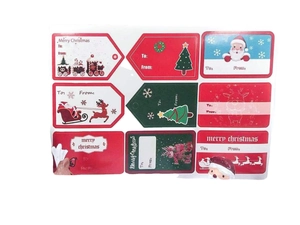 Assorted Christmas gift stickers featuring Santa, reindeer, and Merry Christmas text