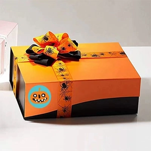 Orange Halloween gift box with pumpkin sticker and decorative spider web ribbon bow