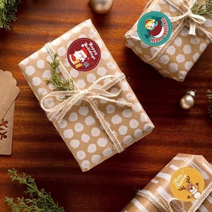 Merry Christmas stickers set with Santa and reindeer on gift boxes with pine branches
