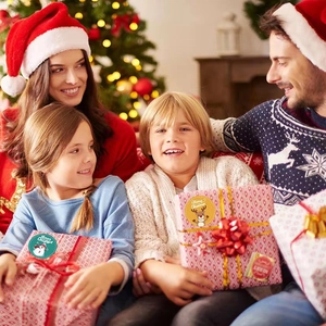 Merry Christmas self-adhesive stickers on gift boxes with a cozy family holiday background
