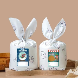 Rectangle Christmas stickers with Santa and snowman designs on white rabbit ear gift bags