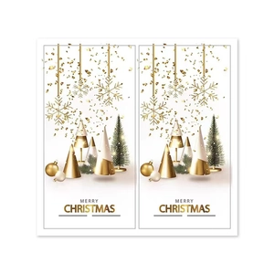 Close-up of elegant Christmas stickers featuring golden snowflakes and festive cone trees