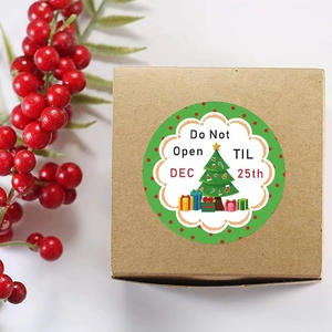 Round Christmas tree stickers on brown gift box with Do Not Open TIL DEC 25th text