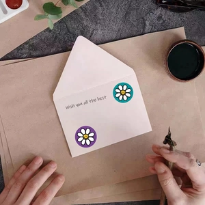Cute daisy smiley face stickers for envelope sealing and DIY journals on brown paper