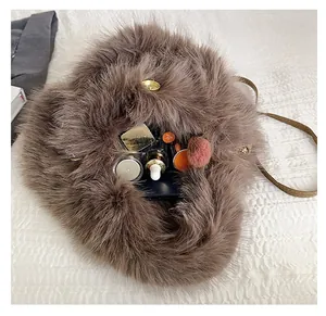 Detail view of brown faux fur crossbody bag interior showing spacious storage capacity