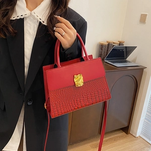 Red crocodile texture handbag with gold metal clasp and crossbody strap for women