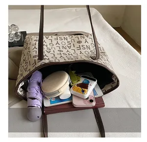 Internal view of a large tote bag showing high capacity for daily essentials and books