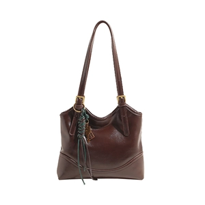 Elegant vintage brown faux leather tote bag with unique green tassel charm detail